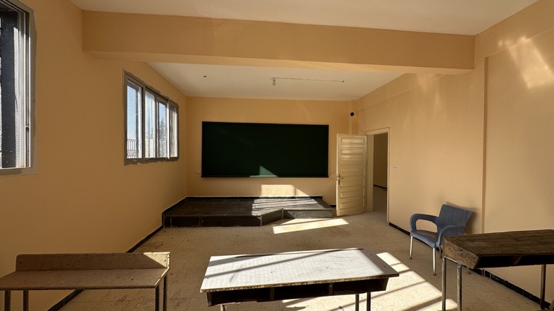 A restored classroom in warm light